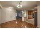Open-concept dining room with hardwood floors leads to the kitchen with modern appliances at 804 Summer Hawk Dr # 5105, Longmont, CO 80504