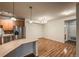 A bright and open kitchen area with stainless appliances and bar seating at 804 Summer Hawk Dr # 5105, Longmont, CO 80504