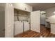 Convenient laundry room with a washer and dryer, and additional shelving for storage at 804 Summer Hawk Dr # 5105, Longmont, CO 80504
