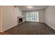 Comfortable living room featuring a cozy fireplace and lovely shutters for natural light at 804 Summer Hawk Dr # 5105, Longmont, CO 80504