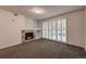 Inviting living space with plush carpet, stylish fireplace, and ample natural light from shuttered windows at 804 Summer Hawk Dr # 5105, Longmont, CO 80504