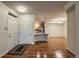 Entryway view of the home with wood floors, fireplace, and kitchen and dining areas at 804 Summer Hawk Dr # 5105, Longmont, CO 80504
