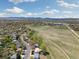 Expansive aerial view of the property showing its proximity to open space and mountain views at 1309 Alexandria St, Lafayette, CO 80026