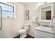 Clean bathroom with a white vanity and natural light at 1309 Alexandria St, Lafayette, CO 80026
