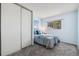 Bedroom with carpet, blue walls, and large closet with sliding doors at 1309 Alexandria St, Lafayette, CO 80026