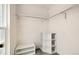 Bright walk-in closet featuring carpeted floors, shelving and closet rods for ample storage at 1309 Alexandria St, Lafayette, CO 80026