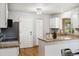 Bright kitchen featuring granite countertops, modern appliances, and ample cabinet space at 1309 Alexandria St, Lafayette, CO 80026