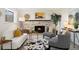 Cozy living room featuring a fireplace and stylish furniture at 1309 Alexandria St, Lafayette, CO 80026