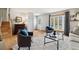Comfortable living room with a fireplace, ample seating, and a large window for natural light at 1309 Alexandria St, Lafayette, CO 80026