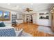Open living room with hardwood floors, lots of light, and multiple windows at 1309 Alexandria St, Lafayette, CO 80026