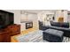 Finished basement with a cozy fireplace and comfortable seating at 16084 Stonebriar Dr, Parker, CO 80134