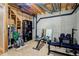 Unfinished basement with exposed ceiling and workout area with weights and equipment at 16084 Stonebriar Dr, Parker, CO 80134