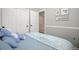 Cozy bedroom with a plush bed, decorative wall art, and an open closet with sliding doors at 16084 Stonebriar Dr, Parker, CO 80134