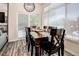 Dining room with wood table, large windows, and lots of natural light at 16084 Stonebriar Dr, Parker, CO 80134