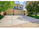 Charming two-story home with a three-car garage, well-maintained lawn, and beautiful landscaping at 16084 Stonebriar Dr, Parker, CO 80134
