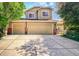 Charming two-story home with a three-car garage, well-maintained lawn, and beautiful landscaping at 16084 Stonebriar Dr, Parker, CO 80134