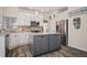 Beautiful kitchen with granite countertops, stainless steel appliances, island and white and gray color palette at 16084 Stonebriar Dr, Parker, CO 80134