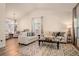 Spacious living room with an open floor plan, hardwood floors, and elegant decor for entertaining at 16084 Stonebriar Dr, Parker, CO 80134