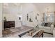 Open-concept living area with vaulted ceilings, hardwood floors, and a staircase leading to the upper level at 16084 Stonebriar Dr, Parker, CO 80134