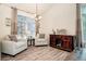 Inviting living room area with plenty of natural light, hardwood floors, and neutral color palette at 16084 Stonebriar Dr, Parker, CO 80134