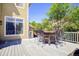 Back patio with outdoor dining set at 16084 Stonebriar Dr, Parker, CO 80134