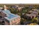 Scenic aerial view of campus buildings, showcasing the property's extensive grounds and architectural details, plus a view of downtown at 5292 Columbine Ln, Denver, CO 80221