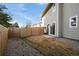 Backyard featuring a fenced yard, stone landscaping and patio area at 5292 Columbine Ln, Denver, CO 80221