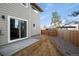Backyard featuring a fenced in yard, patio, stone and natural landscaping at 5292 Columbine Ln, Denver, CO 80221