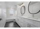 Stylish bathroom with double vanity, and shower-tub combo at 5292 Columbine Ln, Denver, CO 80221
