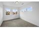 Neutral carpeted bedroom with large windows that fill the room with natural light at 5292 Columbine Ln, Denver, CO 80221