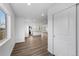 Bright interior view showing a kitchen and wood-look floors throughout a modern open-concept home at 5292 Columbine Ln, Denver, CO 80221