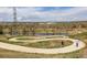 Scenic view of walking trail around a tranquil pond at 5292 Columbine Ln, Denver, CO 80221