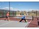 Active pickleball court with players engaged in a friendly match on a sunny day at 5292 Columbine Ln, Denver, CO 80221