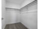 Walk-in closet featuring neutral carpet and metal storage solutions, perfect for organization at 5292 Columbine Ln, Denver, CO 80221