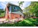 Backyard of home with patio with swing bench and view of the side of the house at 6360 S Kendall St, Littleton, CO 80123