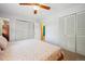 Bedroom featuring a ceiling fan and closet at 6360 S Kendall St, Littleton, CO 80123