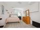 Bedroom with carpet flooring, neutral colored walls, and two dressers and lots of natural light at 6360 S Kendall St, Littleton, CO 80123