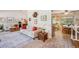 Bright living room with a couch, area rug, and view into the kitchen at 6360 S Kendall St, Littleton, CO 80123