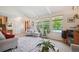 Inviting living room with bright windows and hardwood floors at 6360 S Kendall St, Littleton, CO 80123