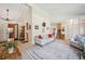 Bright living room with a large carpet, and a staircase at 6360 S Kendall St, Littleton, CO 80123