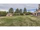 Well-maintained backyard with lush green grass and landscaping at 2035 Buchanan Pt, Lafayette, CO 80026