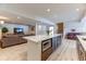 Spacious basement rec room with modern lighting, plank flooring, and large sofa at 2035 Buchanan Pt, Lafayette, CO 80026