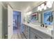 Modern bathroom features double sinks with marble countertops, stylish fixtures, and a walk-in shower at 2035 Buchanan Pt, Lafayette, CO 80026