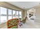 Relaxing bedroom with a seating area, large windows, and scenic views at 2035 Buchanan Pt, Lafayette, CO 80026