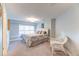Comfortable bedroom with a queen bed, a chair, and a window allowing for plenty of natural light at 2035 Buchanan Pt, Lafayette, CO 80026