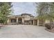 A sprawling single-story home with a circular driveway and an attached multi-car garage at 2035 Buchanan Pt, Lafayette, CO 80026
