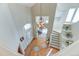 Grand foyer featuring a chandelier, staircase, and front door with sidelights at 2035 Buchanan Pt, Lafayette, CO 80026