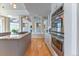 Modern kitchen with stainless steel ovens, granite countertops, and open layout at 2035 Buchanan Pt, Lafayette, CO 80026