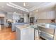 Spacious kitchen featuring dual islands, stainless steel appliances, and a glass table at 2035 Buchanan Pt, Lafayette, CO 80026