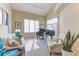 Bright living room with a grand piano, comfortable seating, and large windows at 2035 Buchanan Pt, Lafayette, CO 80026